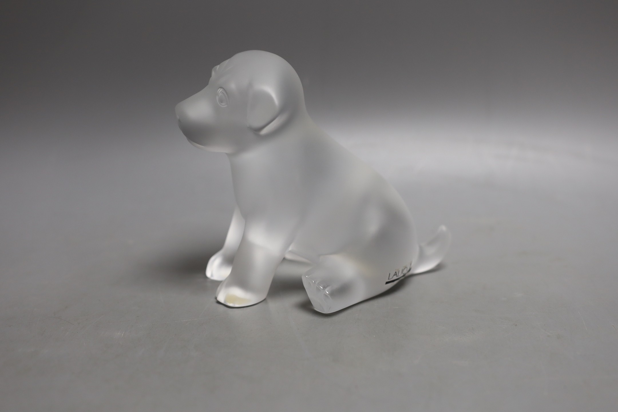 A Lalique dog, base etched ‘Lalique R France’, 13cm